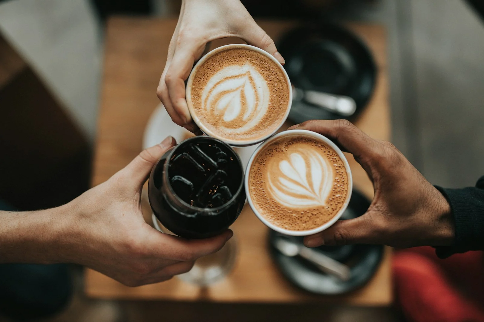 Illustrative cafe website featuring coffee shared with friends